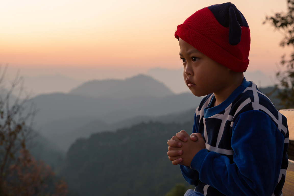 Asian Boy Child Praying with Eyes Open, Christianity Faith Con