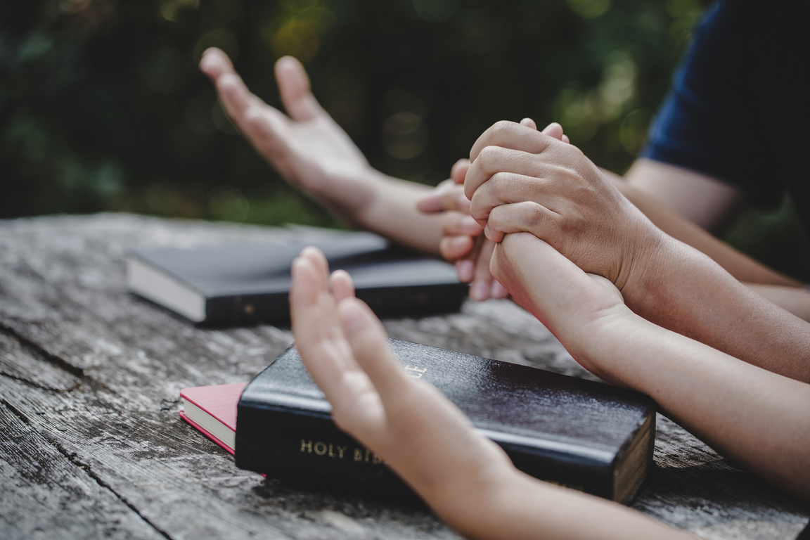 Group of Different Women Praying Together