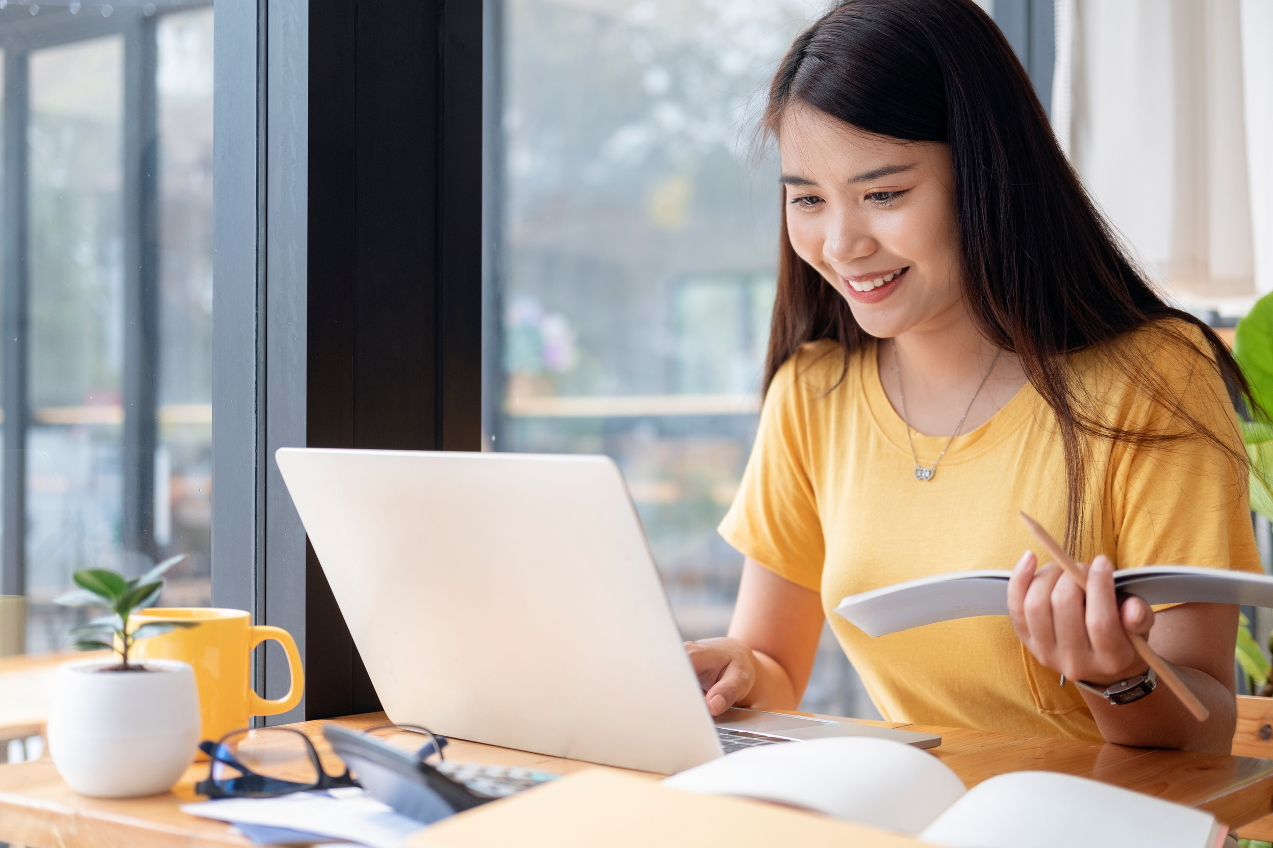 Female Student Studying with Laptop